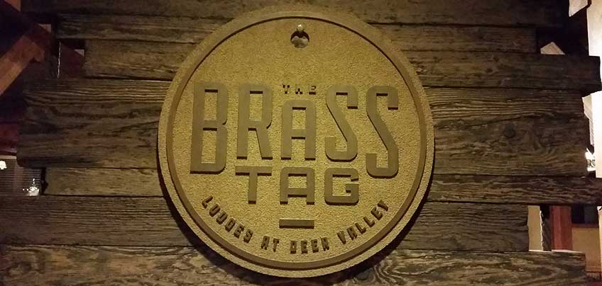 The brass tag deer valley - Logo